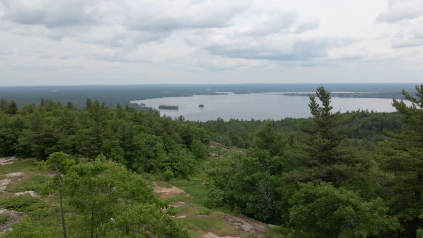 Aerial view of lake and forest along hillside. Calabogie ski hill, Ontario Canada
