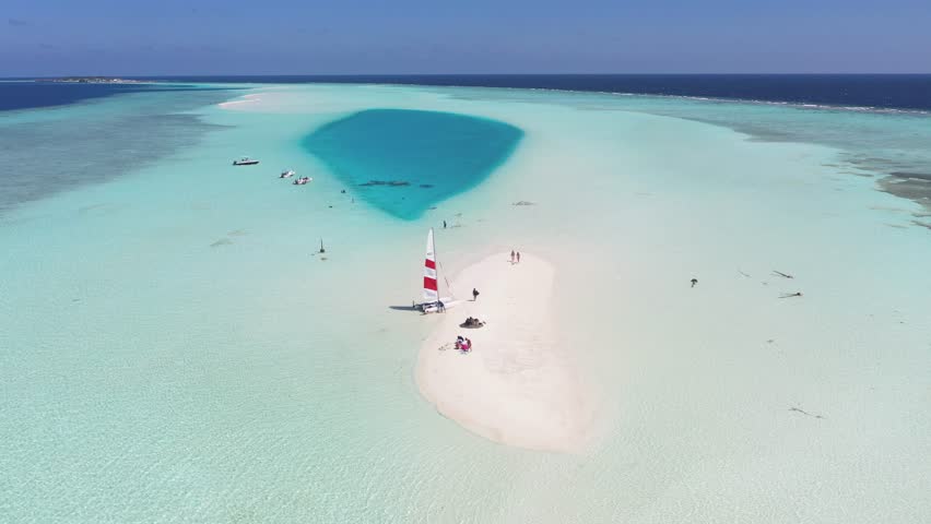 Aerial view of sandbank with sailboat, Maldives.