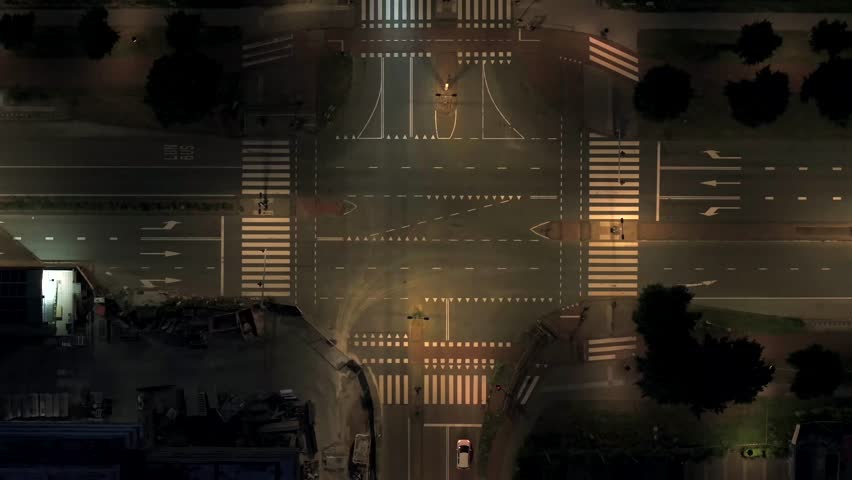 Aerial View of Illuminated Intersection and Construction Site at Night in Amsterdam South