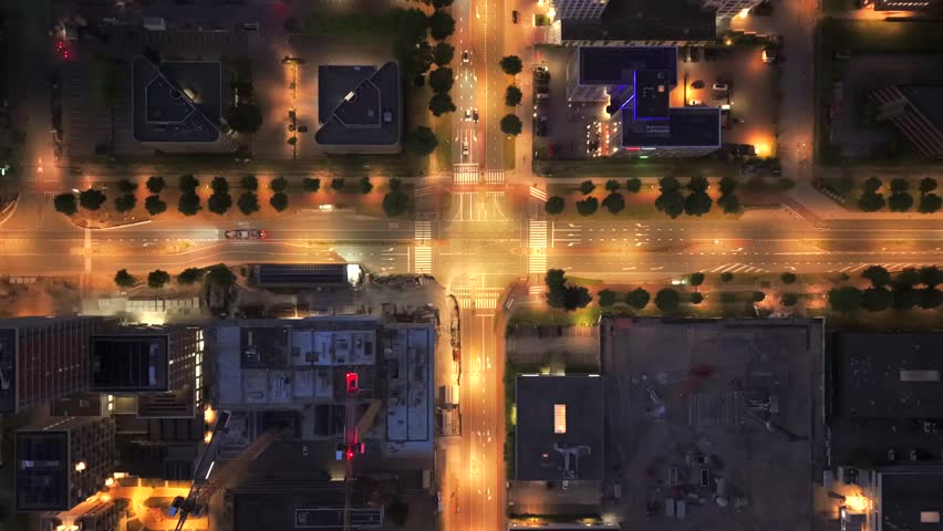 Aerial View of Illuminated Intersection and Construction Site at Night in Amsterdam South