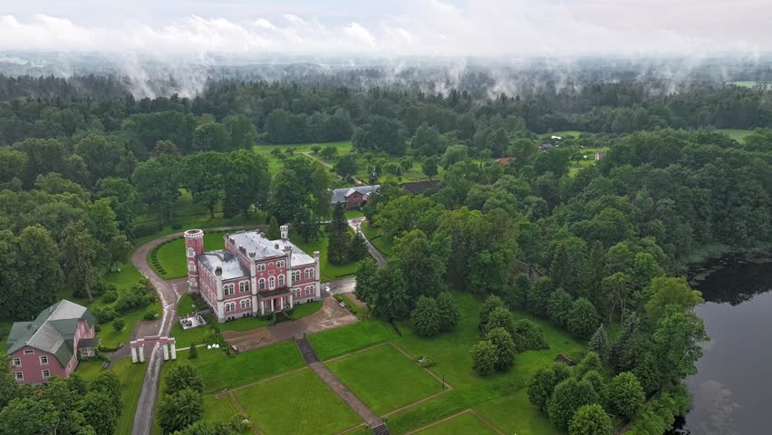 The fog rises from the forest.