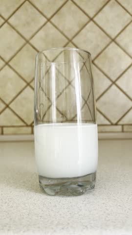 Woman's hand stirring powdered medicine in glass of water with stick. Painkiller solution preparation, close-up healthcare concept
