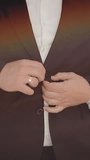 Businessman buttoning his suit jacket while getting ready for work in the city - Powered by Shutterstock - Get 15% off with code: PIKWIZARD15