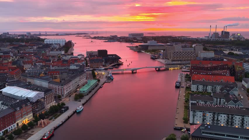 Drone shot of Copenhagen old town at sunrise, Copenhagen is the capital of Denmark, river and bridges in Copenhagen, Scandinavian capital. High quality 4k footage