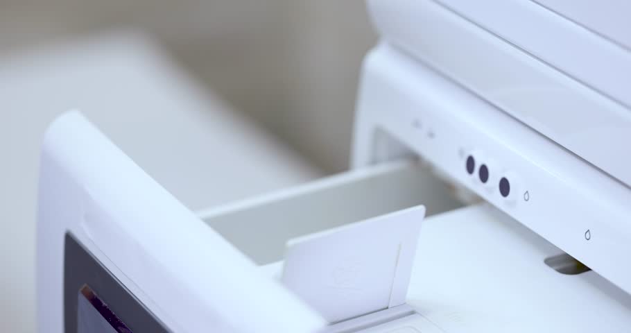 Woman pours liquid laundry detergent into compartment of washing machine, close-up