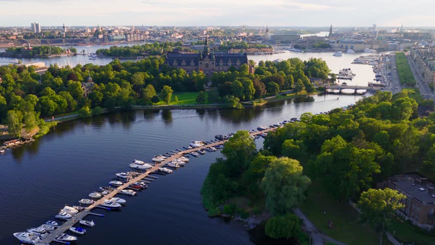 Stockholm archipelago at sunset, drone view. Flying over downtown Stockholm, Sweden. Amazing drone footage of Stockholm yacht canal and the Nordic Museum. 