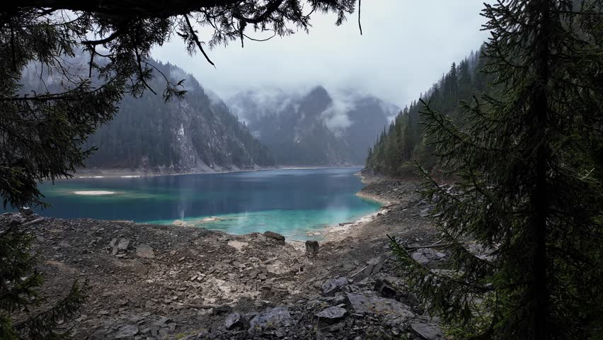 Jiuzhaigou, China: Dramatic view of the long lake on a foggy spring morning in the famous jiuzhaigou scenic area in the mountain of Sichuan in China