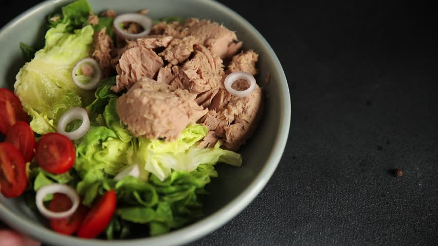 Tuna salad green leaf lettuce, canned tuna, tomato fresh delicious gourmet food background on the table rustic food top view copy space keto and paleo diet vegetarian food pescetarian diet