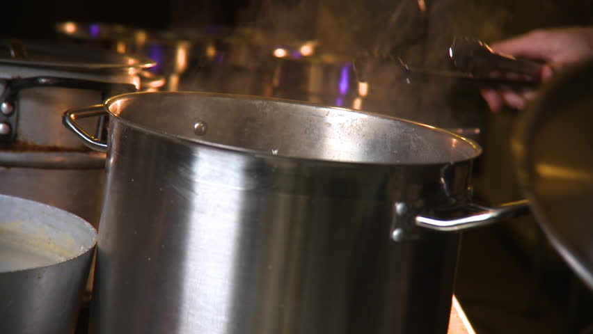 Lobster being taken out of boiling water