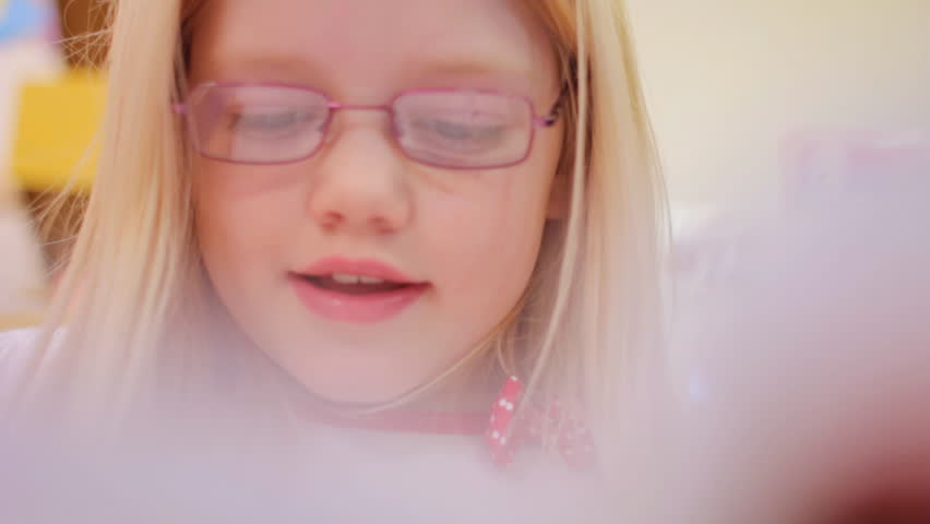 Reading - an elementary school girl reading at school
