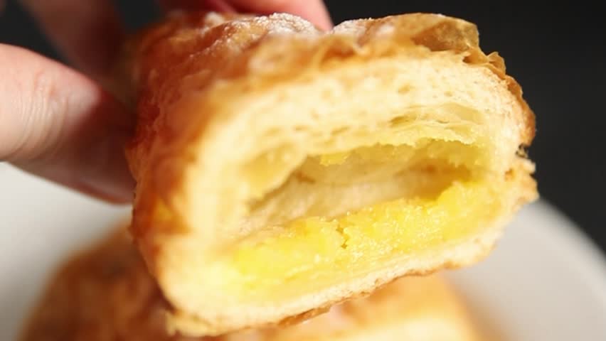 Triangle cake almond puff pastry sweet dessert almond cream filling fresh delicious gourmet food background on the table rustic food top view copy space