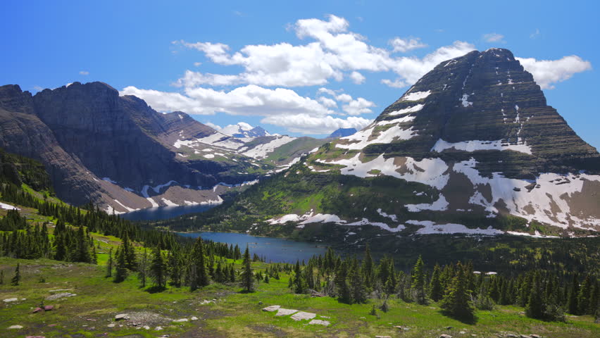 Discover the stunning landscapes of Glacier National Park with its towering mountains, lush greenery, and serene lakes, offering peaceful retreats for those seeking relaxation and adventure