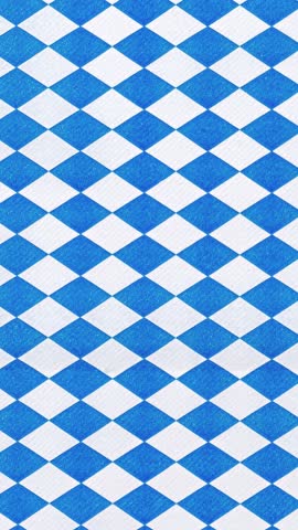 Oktoberfest background decoration with Bavarian flag pattern blue white diamonds moving. Ideal for use in event invitations, party flyers, beer festival, vertical video