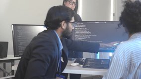 Senior developer mentoring a diverse team in a corporate training session. Professionals upskilling in AI development and advanced programming for future tech jobs in a modern classroom. - Powered by Shutterstock - Get 15% off with code: PIKWIZARD15