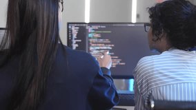 Agile team leader guiding diverse software developers in a sprint planning meeting. Multicultural group collaborating on a new project, reviewing complex code on a computer screen. - Powered by Shutterstock - Get 15% off with code: PIKWIZARD15