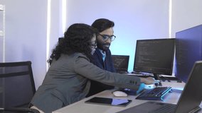 Forward-thinking tech team strategizing future innovations. Multi-ethnic professionals discuss AI-driven solutions in a bright, contemporary workspace, focused on a shared digital interface. - Powered by Shutterstock - Get 15% off with code: PIKWIZARD15