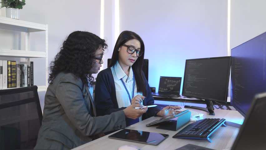 Expert IT team executing complex algorithm design and blockchain integration on multiple digital interfaces. Focused on decentralized solutions and neural network architecture in a cutting-edge develo