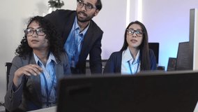 Forward-thinking tech team strategizing future innovations. Multi-ethnic professionals discuss AI-driven solutions in a bright, contemporary workspace, focused on a shared digital interface. - Powered by Shutterstock - Get 15% off with code: PIKWIZARD15