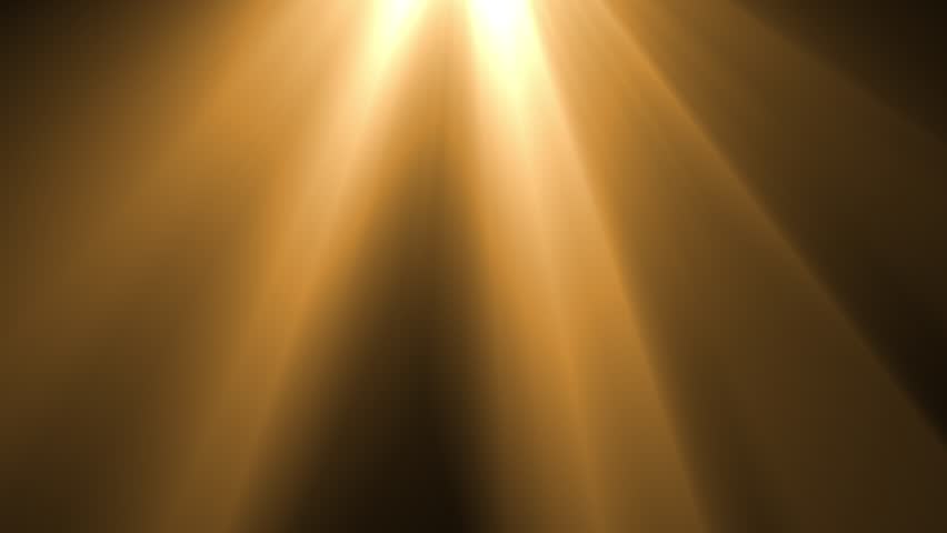 Abstract golden light rays stream down from above, creating a warm, ethereal glow on a dark background.