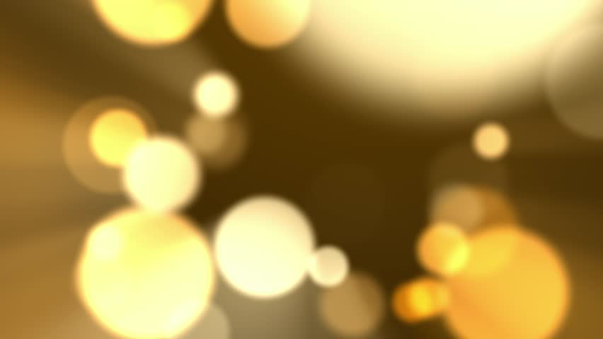 This image showcases a warm, golden bokeh effect with blurred circular lights, creating a dreamy and festive atmosphere.