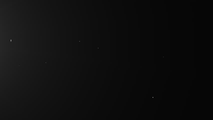 Tiny White Glowing space dust particles on black screen background