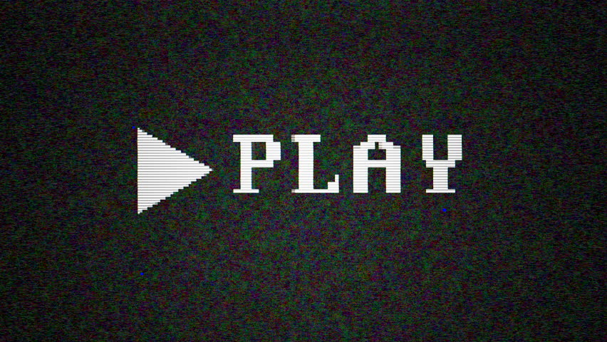 Vintage monitor displays "Play" icon flickering on paused VHS screen