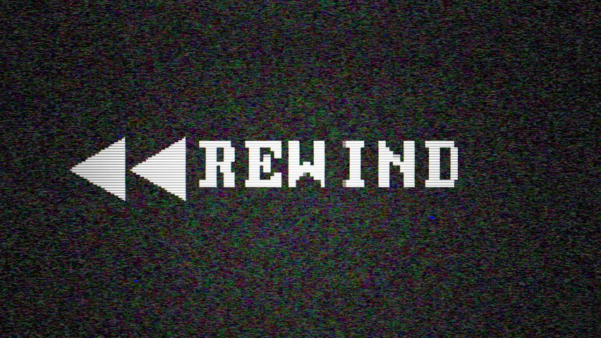 Vintage monitor displays "Rewind" icon glitching on retro VHS screen