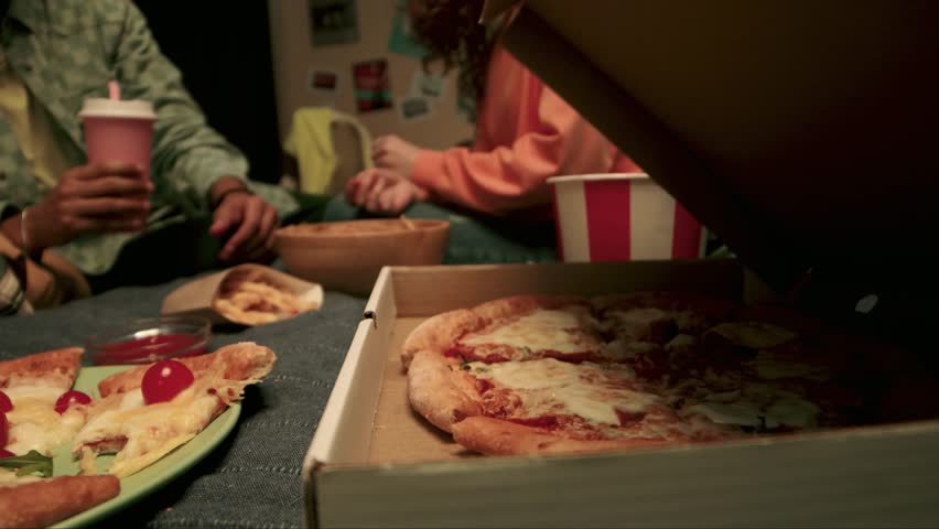 Happy laughing friend people buddies students teenagers African American female women girls Caucasian guys male man eating pizza food delivery together snack tasty. fast food. family hand. watching TV