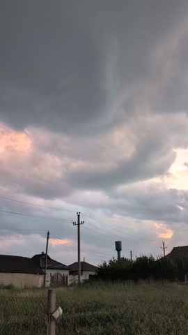 A Dramatic Sky Over a Serene Rural Landscape Captured Beautifully at Dusk During Sunset