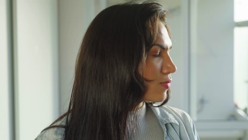 Portrait of a Confident Transgender Woman with Long Hair
