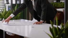 African American businessman business man professional engineer architect coming in office holding paper blueprint building plan entrepreneur male put sketch on table analyze city development design - Powered by Shutterstock - Get 15% off with code: PIKWIZARD15