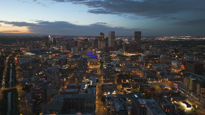 Aerial view overlooking the illuminated downtown of Denver, dawn in CO, USA