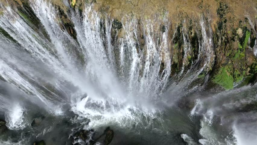 The spectacular waterfall at Marmore Falls, seen from a drone: the melted water from the glacier begins its journey toward the sea after the spring thaw.  drought aridity 