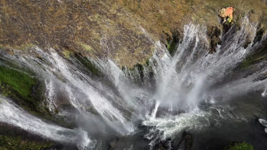 The spectacular waterfall at Marmore Falls, seen from a drone: the melted water from the glacier begins its journey toward the sea after the spring thaw.  drought aridity 