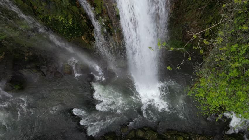 The spectacular waterfall at Marmore Falls, seen from a drone: the melted water from the glacier begins its journey toward the sea after the spring thaw.  drought aridity 