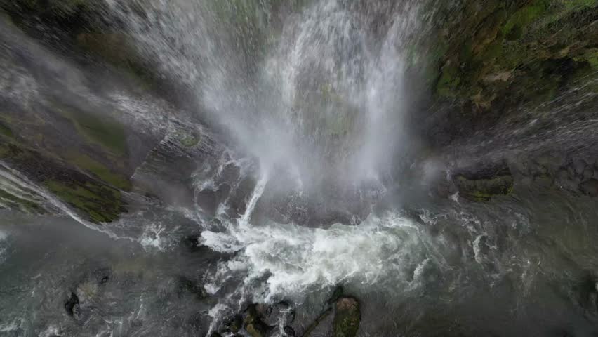 The spectacular waterfall at Marmore Falls, seen from a drone: the melted water from the glacier begins its journey toward the sea after the spring thaw.  drought aridity 