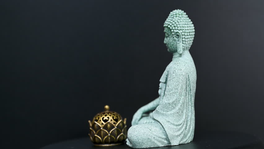 video buddha statue on black background