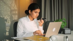 Confident young indian woman recording voice recognition message using virtual assistant app on smartphone at home Pretty female has working or personal conversation on mobile phone indoors - Powered by Shutterstock - Get 15% off with code: PIKWIZARD15
