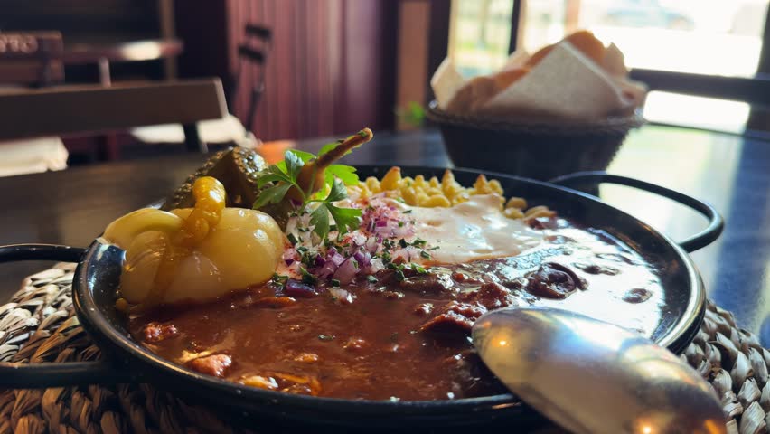 Paprikash. Traditional Hungarian dish consisting of stewed meat, chicken or veal, in a paprika and sour cream-based sauce with noodles. High quality 4k footage