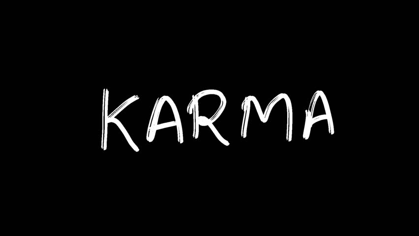 Hand written KARMA word on black background