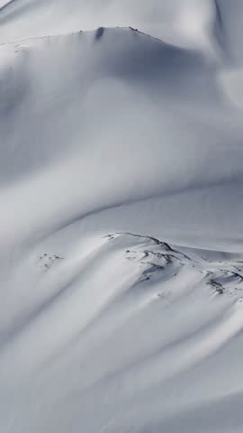 Breathtaking Aerial View Of Pristine Snow-Covered Mountains In British Columbia, Canada