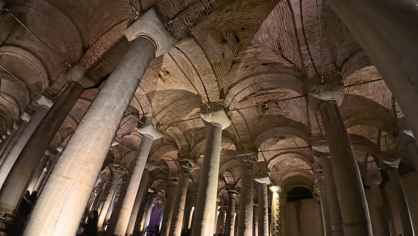 İstanbul,Turkey -  05.14.2025 - Vibrant orange and green lighting inside the Basilica Cistern in Istanbul, creating a mesmerizing and mystical atmosphere.