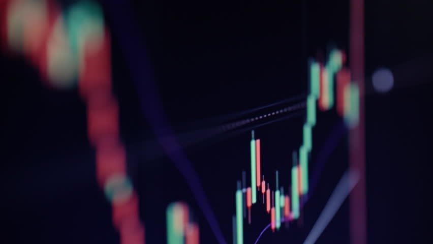 Closeup digital asset chart with glowing lines shows crypto motion. Virtual coin values like ether or bitcoin rise and fall on tablet macro. Platform displayed on monitor supports trader strategy