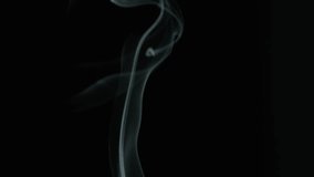 Closeup delicate smoke stream swirling on black isolated background. Dim studio holding silence. Thin curls rising up filling empty space. Incense sticks. Abstract shapes. Spiritual practice concept - Powered by Shutterstock - Get 15% off with code: PIKWIZARD15