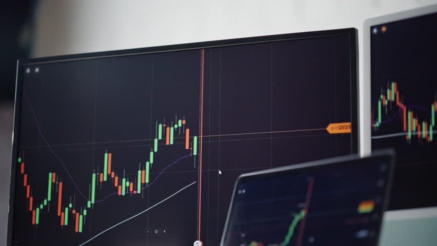 Cryptocurrency trading chart monitors at office closeup. Online graph forex financial analyze. Stocks fund crypto coin trend growth. Growing digital rising market candlestick gain investment profit