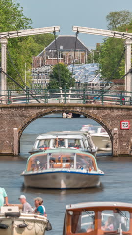 Timelapse of a busy canal boat trip in Amsterdam