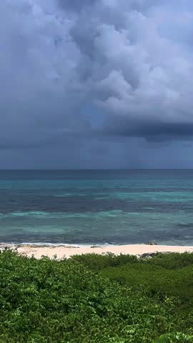 Isla Mujeres Cancun mexico sandy beach with thunderstorm out at sea 