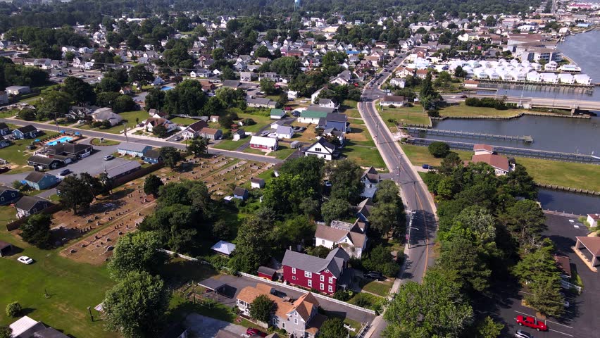 Picturesque seaside town in Virginia with houses and road along the shore. Chincoteague Island in the state of Virginia.
