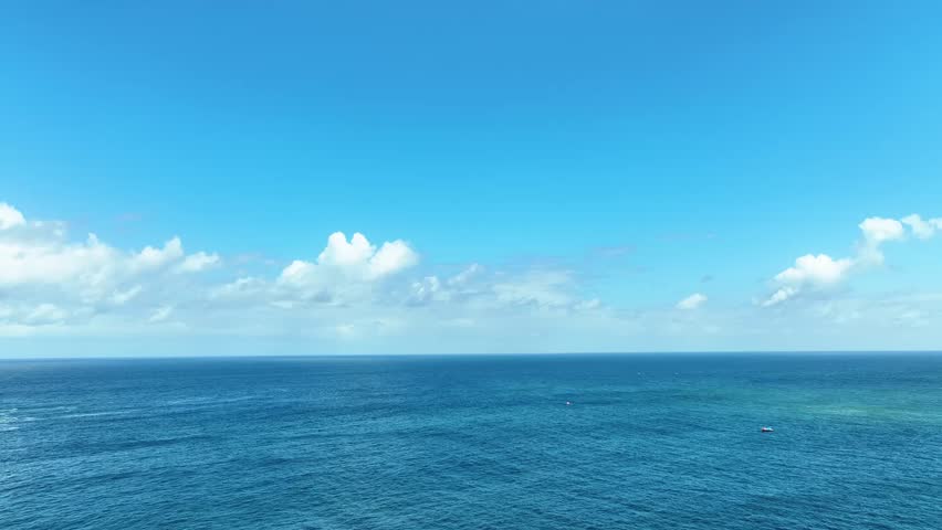 Open Blue Ocean Under Clear Sky at Wediombo
