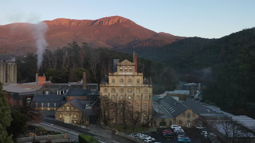 Sunrise over Cascade Brewery Mt Wellington Kunanyi, Tasmania, Australia Aerial Drone 4K